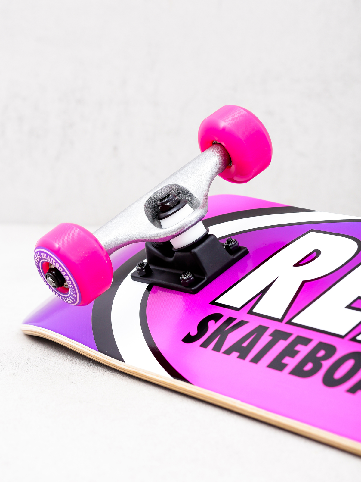 Deskorolka Real Fades (purple/pink)