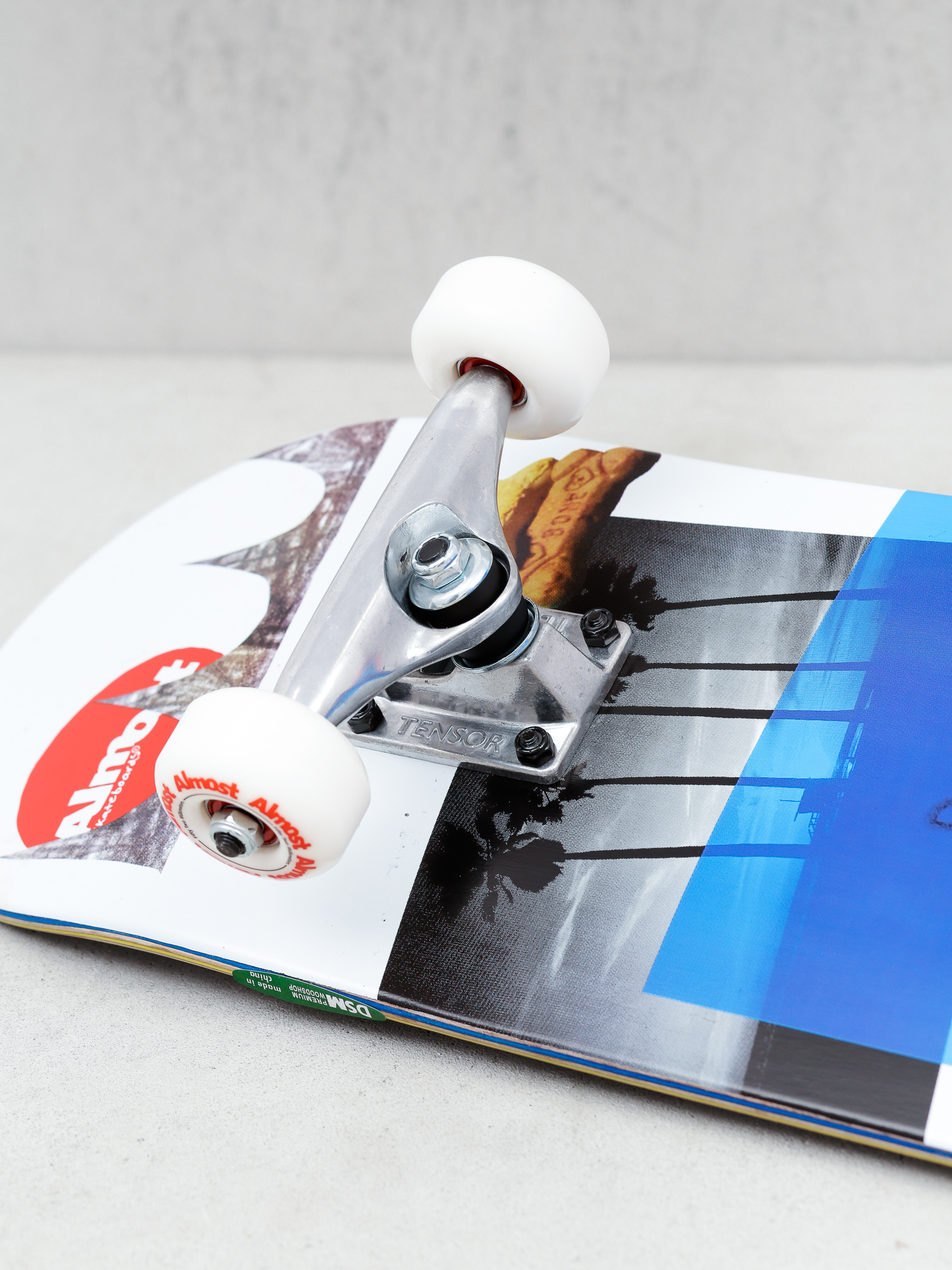 Deskorolka Almost Mullen Scraps (white/black/blue/red)