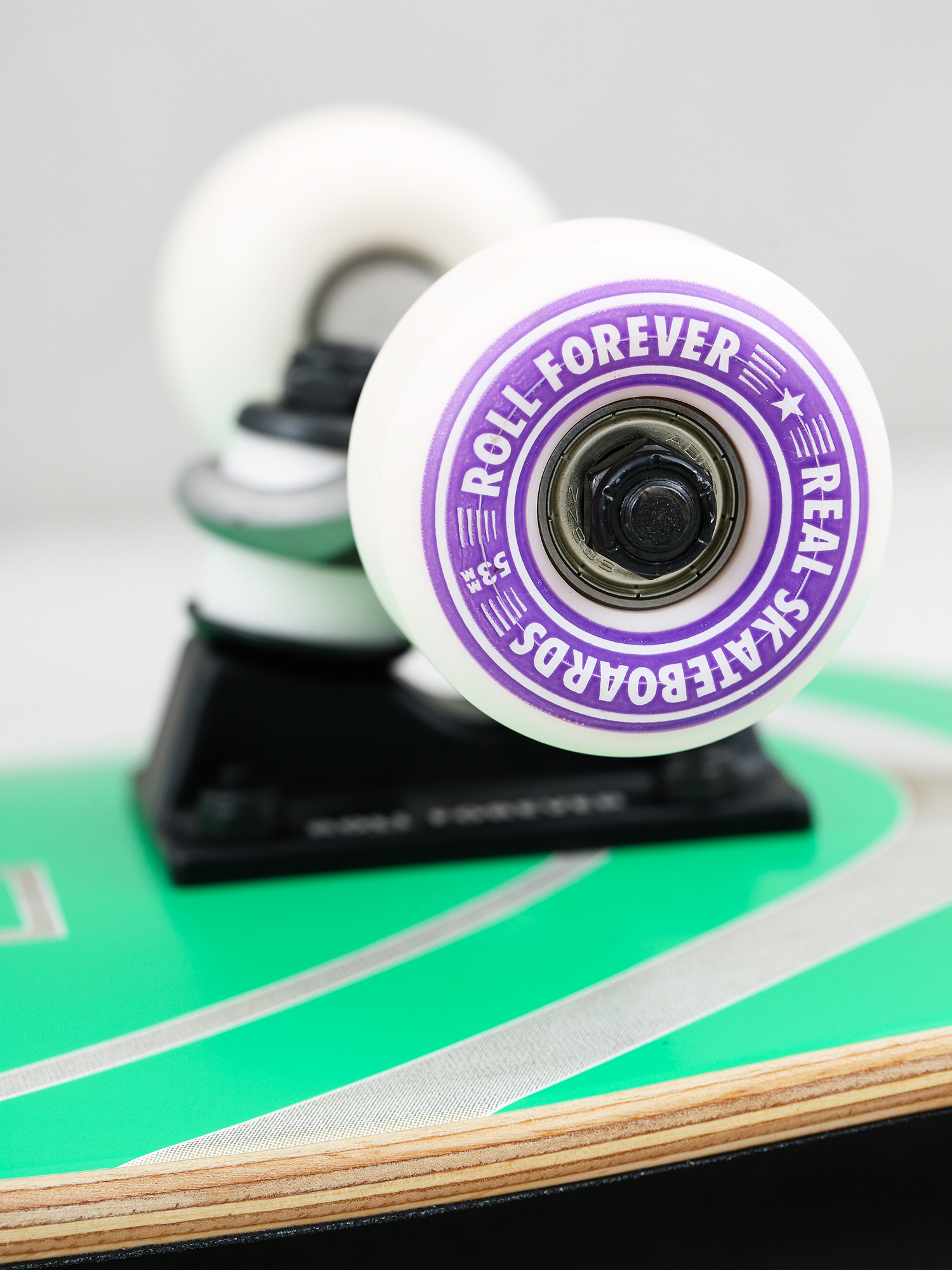 Deskorolka Real Outliners (purple/green)