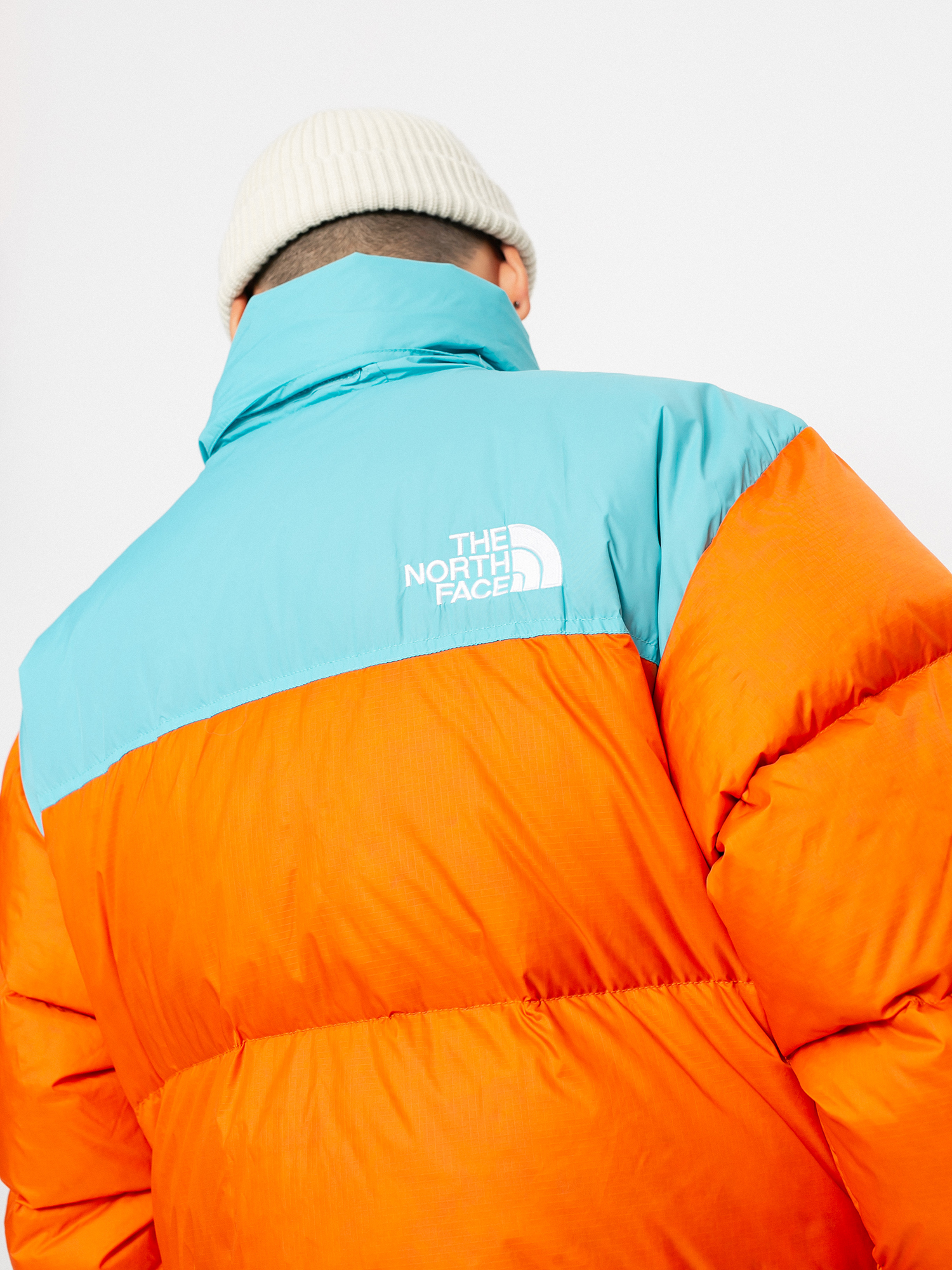 Kurtka The North Face 1996 Retro Nuptse (red orange/transantarctic blue)