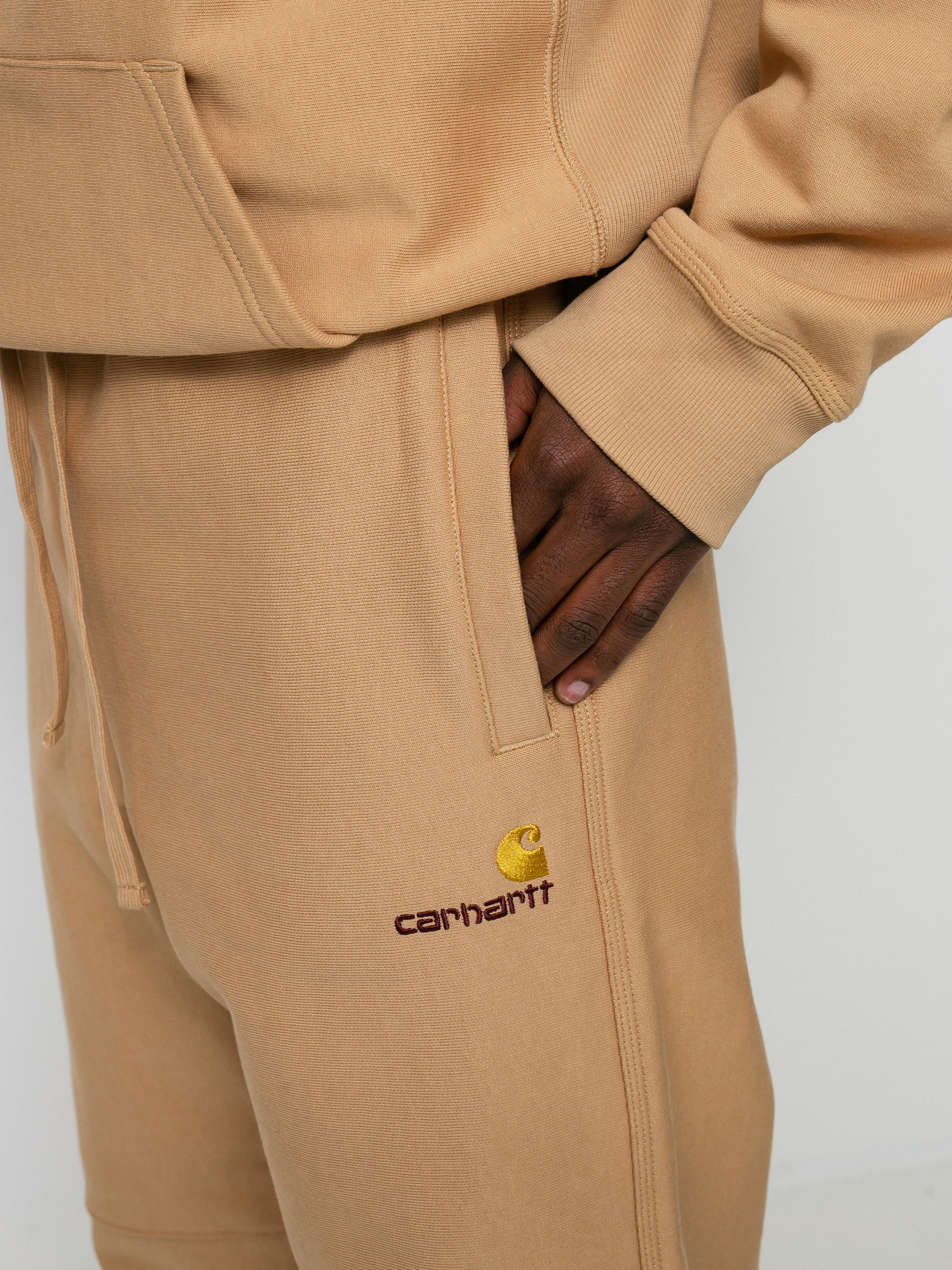 Spodnie Carhartt WIP American Script Jogging (dusty h brown)