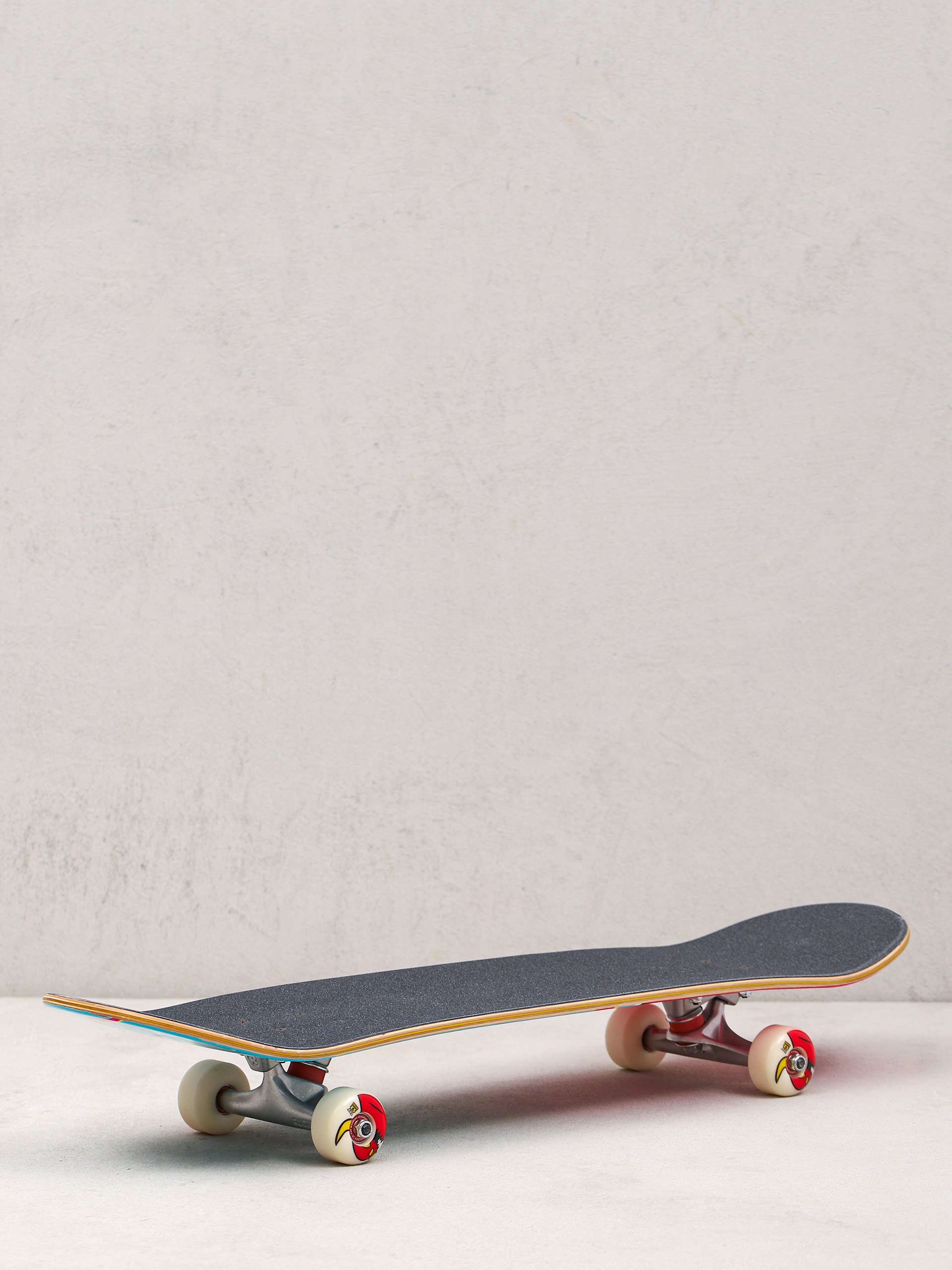 Deskorolka Toy Machine 80s Monster (light blue/pink)