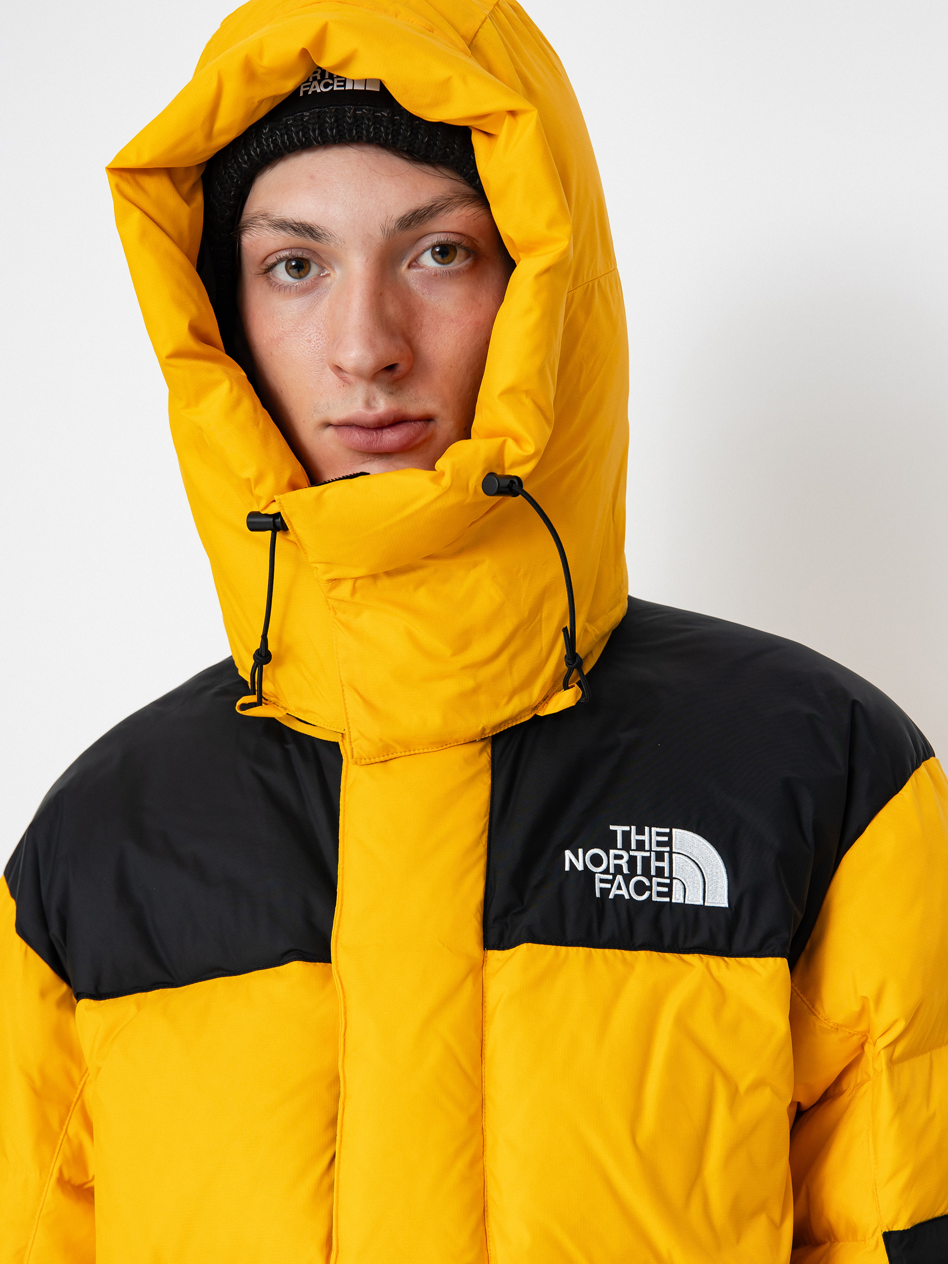 Kurtka The North Face Hmlyn Baltoro (summit gold tnf black n)