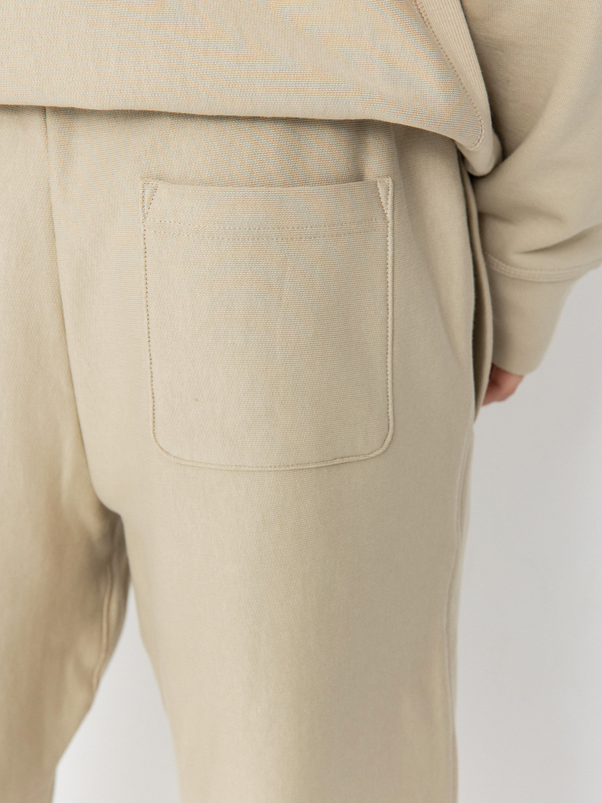 Spodnie Carhartt WIP American Script Jogging (fleur de sel)