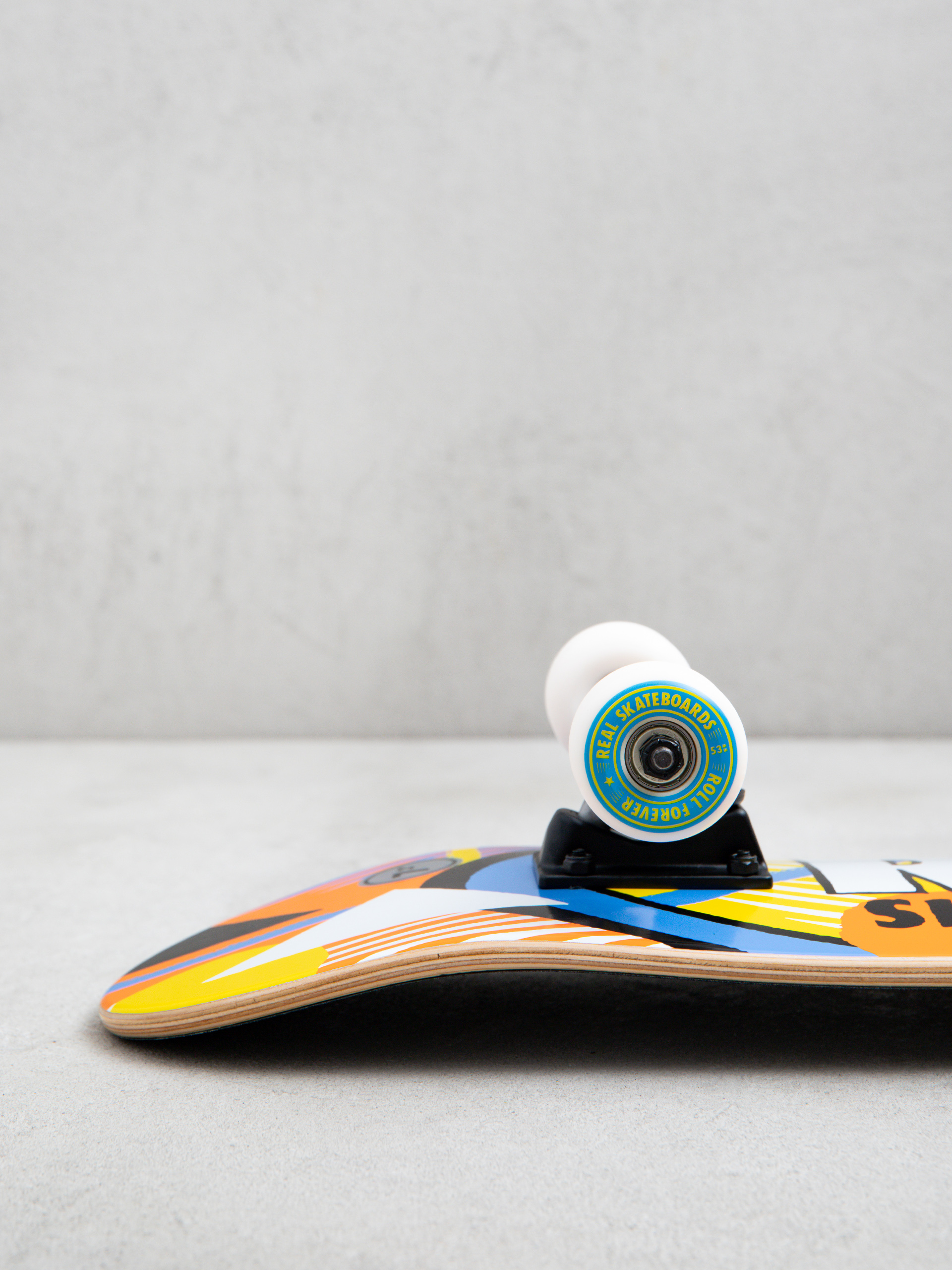 Deskorolka Real Hatched (orange/blue/yellow)